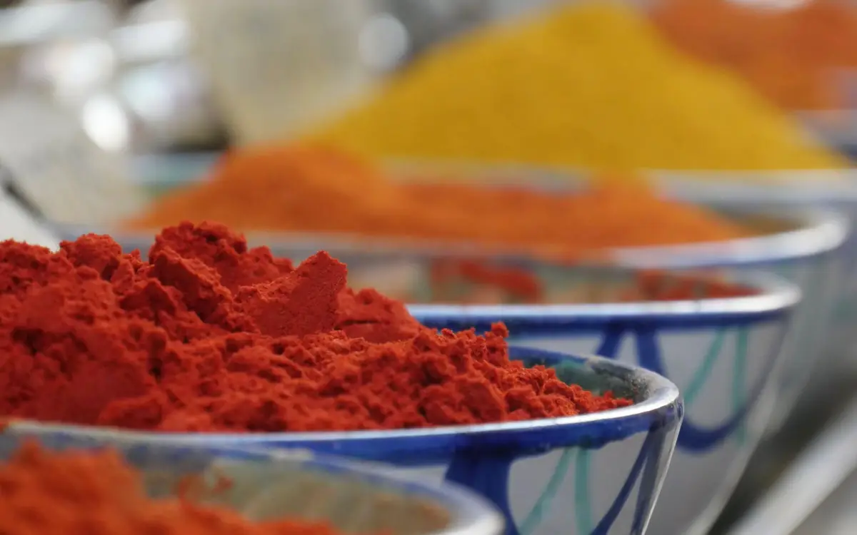 Bowls of red and yellow spices